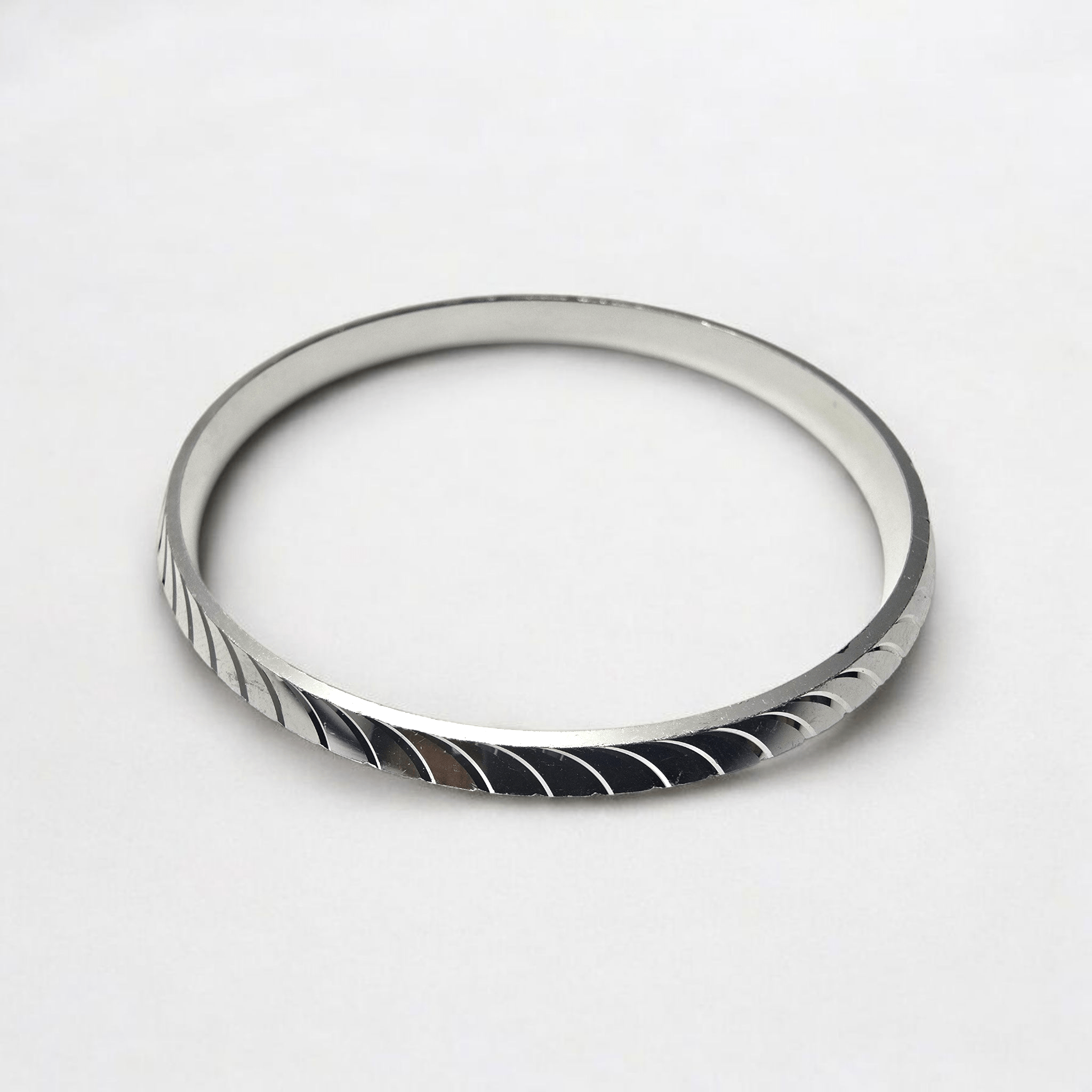 Silver Blade Textured Kada – Sleek Geometric Swirl 2 Top view of Silver Blade Textured Kada