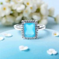 Close up of Azure Regal Ring – Blue Emerald-Cut & CZ Accents in 925 Silver