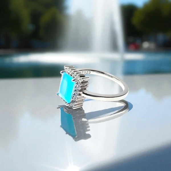 Side view of Azure Regal Ring – Blue Emerald-Cut & CZ Accents in 925 Silver