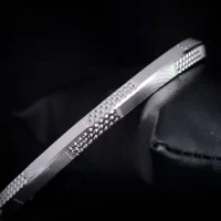 Side closeup black bg Linear Block Textured Kada