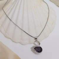 Display of Elegant Swan Pendant Necklace