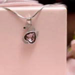 Hanging view of Blush Heart Swan Pendant Necklace
