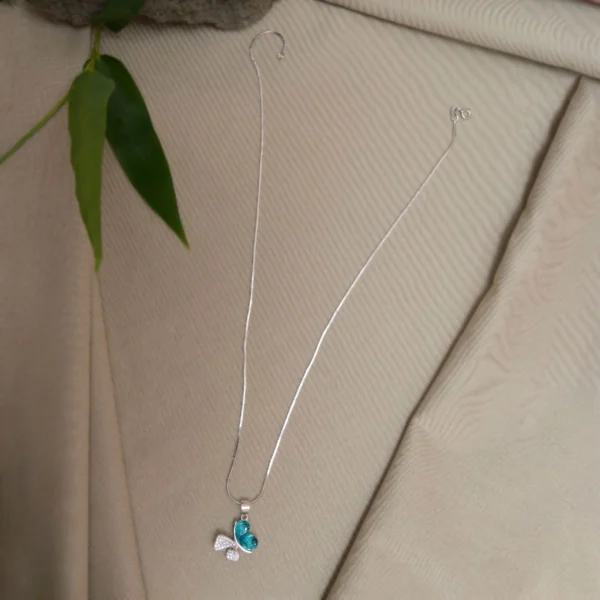 Full length display of Butterfly Dream Pendant Necklace – 925 Silver with Teal Heart-Cut Gemstones