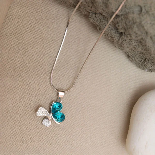 Locket display of Butterfly Dream Pendant Necklace – 925 Silver with Teal Heart-Cut Gemstones