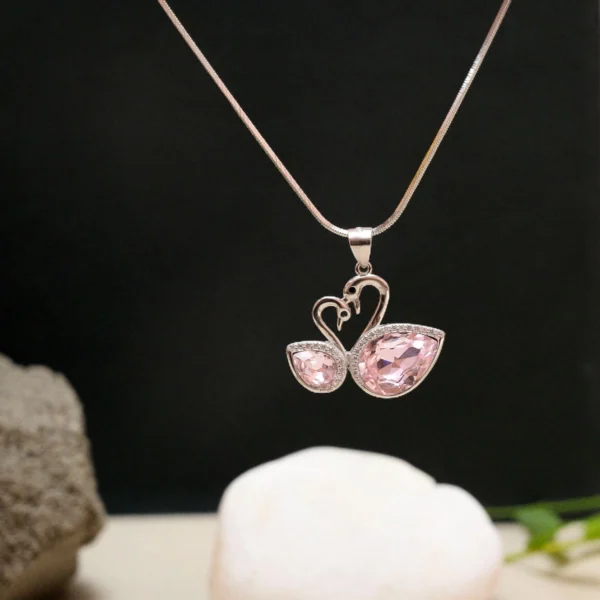 Hanging display of Swan Love Pendant Necklace – 925 Silver with Pink Pear-Cut Gemstones