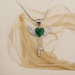 Top view of Green Heart Winged Key Pendant Necklace