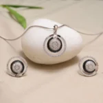Close up of Midnight Orbit Halo Pendant Set