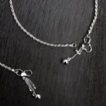 Close up of Rope Chain Anklets – Classic Twisted 925 Silver Design with Dangling Charms