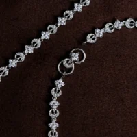 Charms and close up display of Infinity Link Anklets