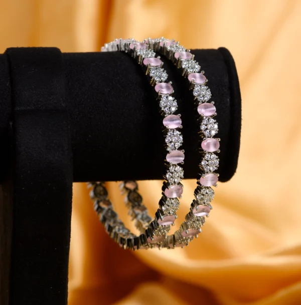 Hanging display of Pink Oval Stone CZ Designer Bangles in 925 silver
