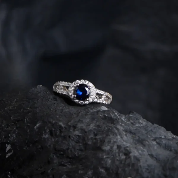 Full tilted display with center stone and CZ of Sapphire Elegance Ring – 925 Silver