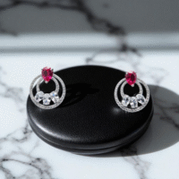 Close up of Ruby Orbit Studs