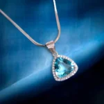 Close up of Trillion Cut Blue Topaz Halo Pendant Necklace