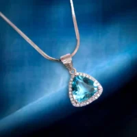 Close up of Trillion Cut Blue Topaz Halo Pendant Necklace