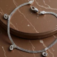 Close up of Pebble Charm Anklets