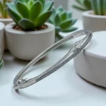 Tilted display of Silver Heart Kada Fine Row of Micro-Set CZ in 925 Silver