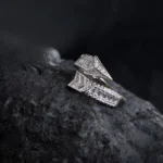 Tilted stylish display of Arrowline Ring – Sleek Baguette CZ Wrap in 925 Silver