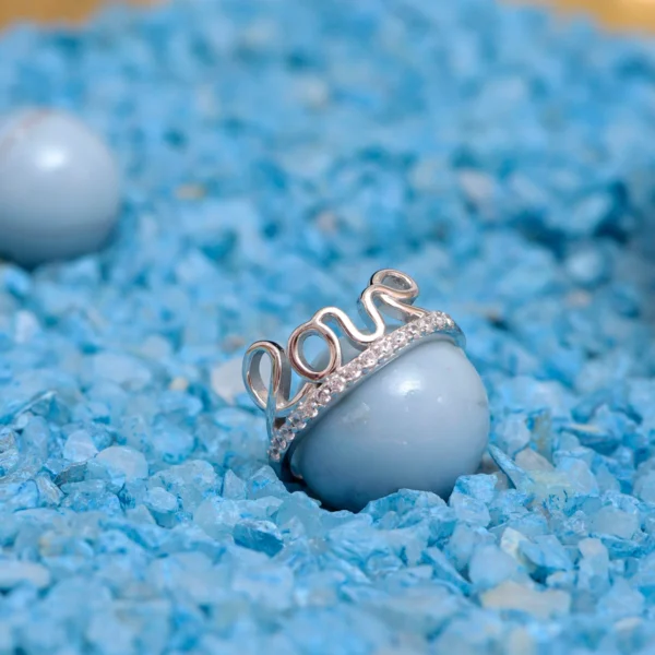 Bottom CZ display in slanting view of Love Script Pave Ring 925 Silver