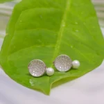 Close up of Disc Pearl Stud Earrings 925 Silver