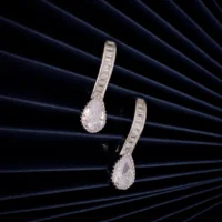 Close up of Huggie Hoops with Pear Drop Earrings 925 Silver