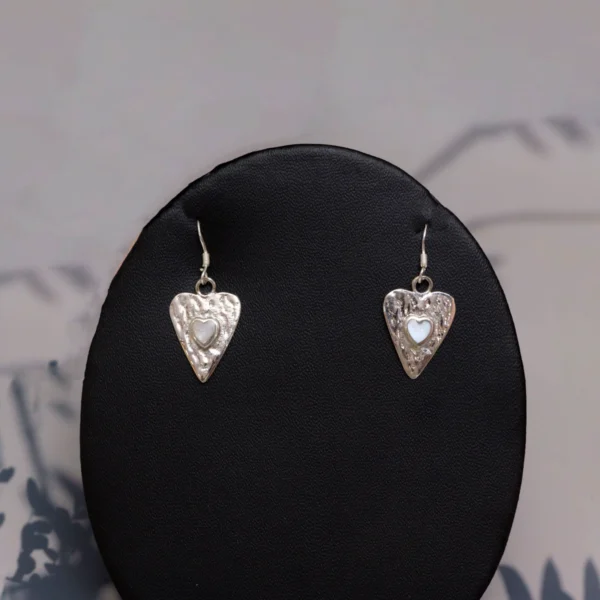 Close up of Mother of Pearl Heart Earrings 925 Silver
