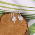 Close up of Pear Halo Half Hoops 925 Silver