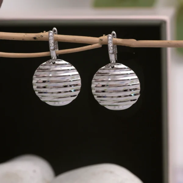 Close up of Ripple Disc Drop Earrings 925 Silver