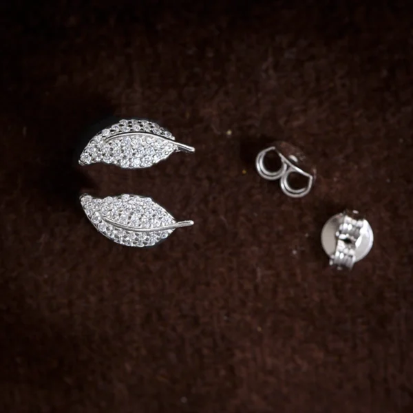 Earrings close up with butterfly backs display of Leaf Pearl Drop Lariat Set 925 Silver