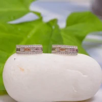 Front view of Rainbow Channel Huggie Earrings 925 Silver