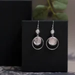 Hanging view of Modern Disc and Orb Drop Earrings 925 Silver