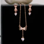 Pendant and earrings close up of Rose Gold Bow Lariat Set 925 Silver