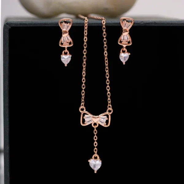 Pendant and earrings close up of Rose Gold Bow Lariat Set 925 Silver