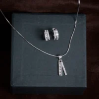 Pendant and earrings display of Baguette Bar Pendant and Huggie Set 925 Silver