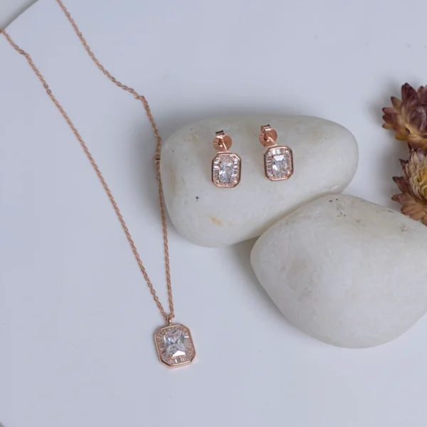 Pendant chain and earrings display of Rose Gold Emerald Cut Halo Set 925 Silver