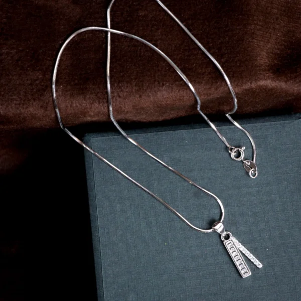 Pendant with snake chain display of Baguette Bar Pendant and Huggie Set 925 Silver