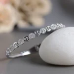 Slanting front view of Alternating Pave Circle Kada 925 Silver