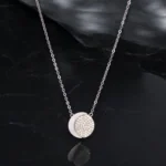 Close up of Celestial Moon Pave Disc Necklace 925 Silver