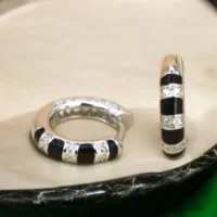 Close up of Chic Black Enamel CZ Huggie Hoop Earrings 925 Silver