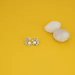 Close up of Elegant Pearl Pave CZ Stud Earrings 925 Silver