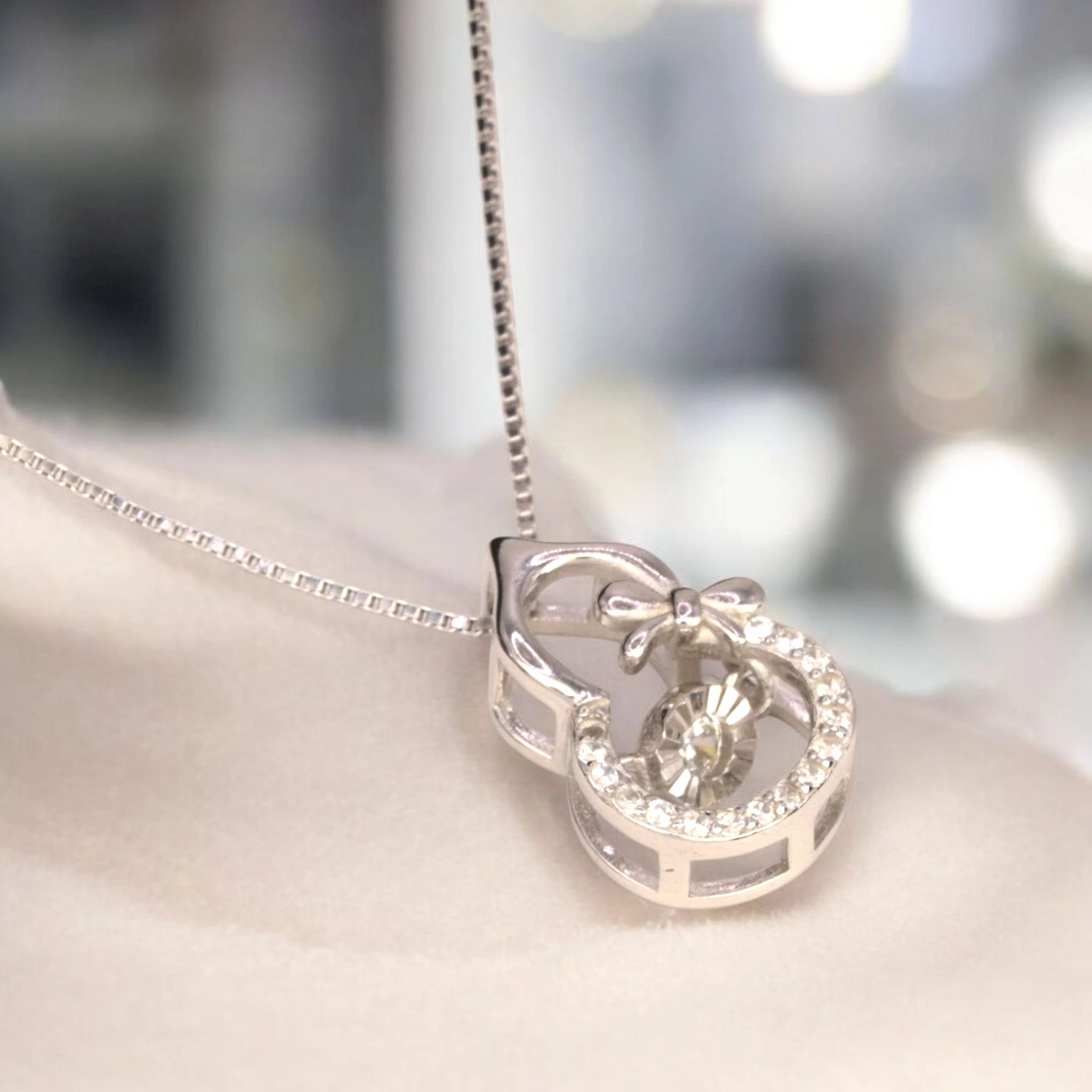 Intertwined Swirl Necklace with Dancing CZ – 925 Silver 1 Close up of Intertwined Swirl Necklace with Dancing CZ 925 Silver