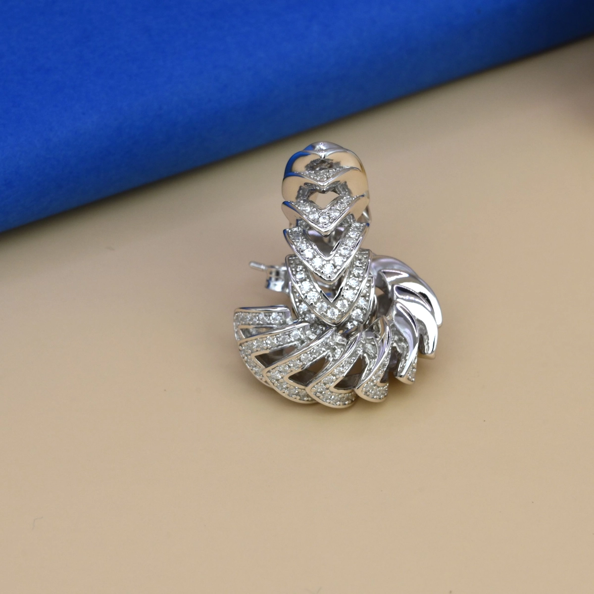 Sculptural Pave Huggie Hoop Earrings – 925 Silver 1 Close up of Sculptural Pave Huggie Hoop Earrings 925 Silver