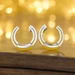 Close up of Sparkling CZ Pave Huggie Hoop Earrings 925 Silver