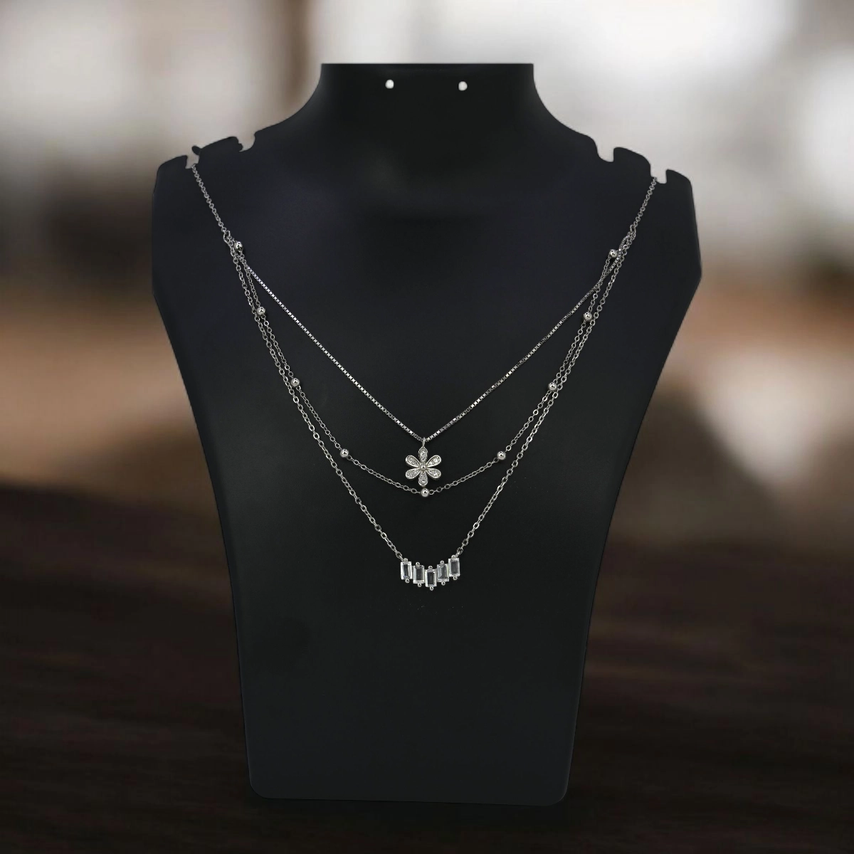 Layered Floral Baguette CZ Necklace – 925 Silver 2 Display on bust of Layered Floral Baguette CZ Necklace 925 Silver