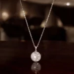 Hanging view of Luminous Pearl Pave CZ Starburst Necklace 925 Silver