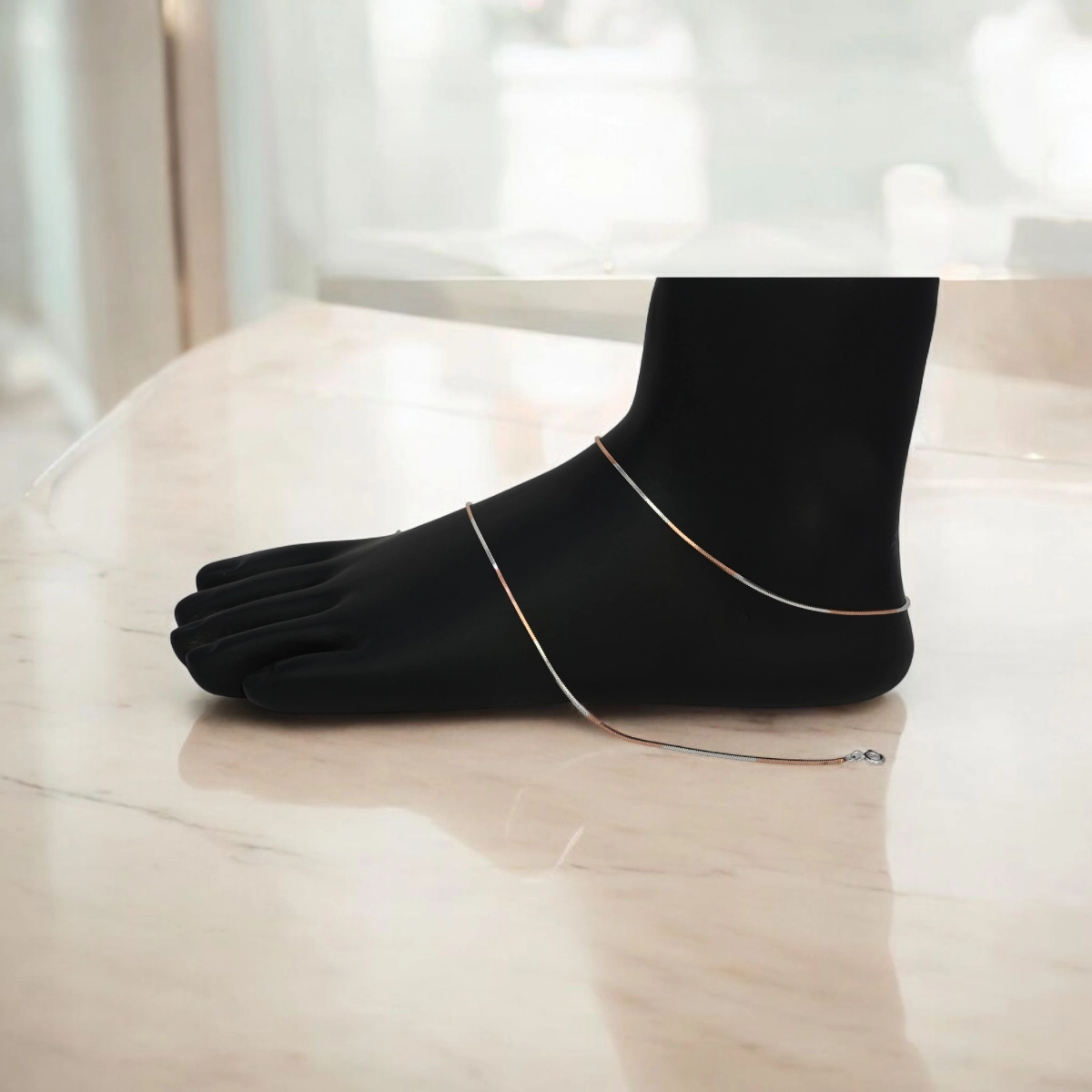 Rose Gold and Silver Dual-Tone Snake Chain Anklets – 925 Silver 1 Mannequin leg with anklet on display of Rose Gold and Silver Dual-Tone Snake Chain Anklets 925 Silver