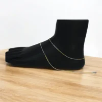 Mannequin leg with anklets on display of Dainty Dual-Tone Snake Chain Anklets 925 Silver