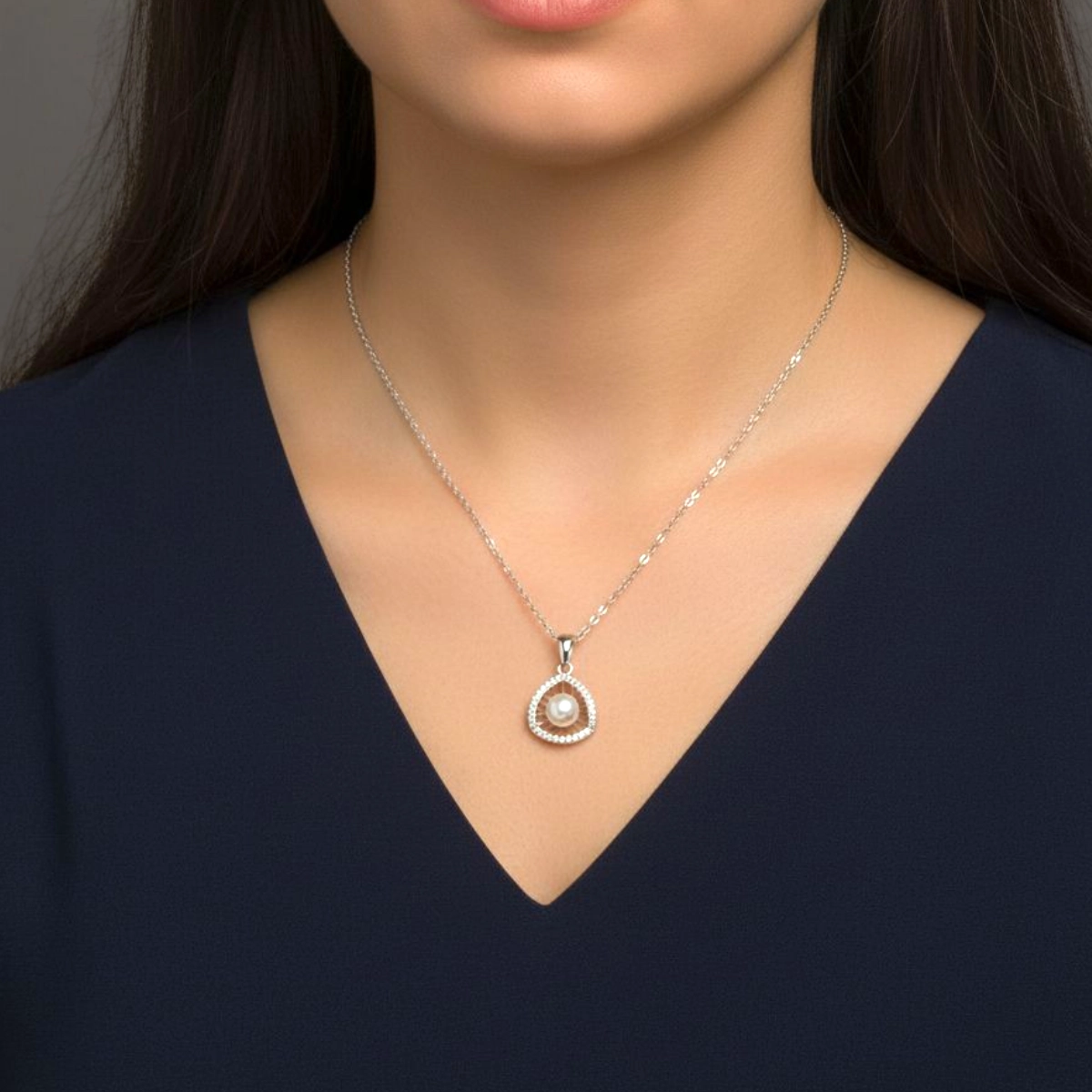 Modern Pearl CZ Triangle Halo Necklace – 925 Silver 3 Model wearing Modern Pearl CZ Triangle Halo Necklace 925 Silver