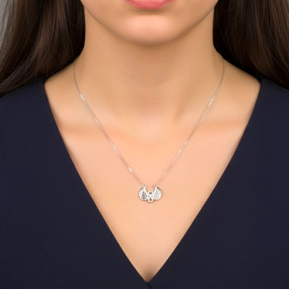 Sparkling Pave CZ Angel Wing Necklace – 925 Silver 2 Model wearing Sparkling Pave CZ Angel Wing Necklace 925 Silver