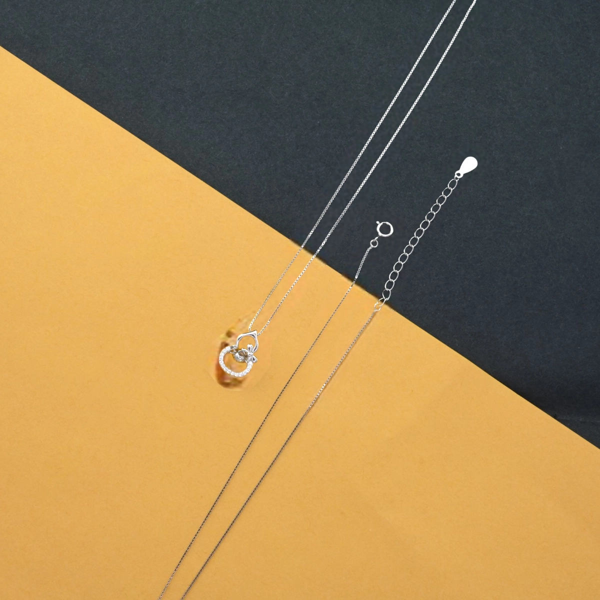 Intertwined Swirl Necklace with Dancing CZ – 925 Silver 4 Pendant and locking mechanism display of Intertwined Swirl Necklace with Dancing CZ 925 Silver