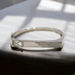 Close up of Modern X-Cross Triple Stripe Kada 925 Silver